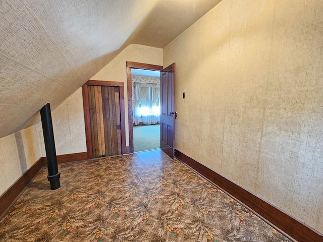 216 E Delaware St, Dwight, IL 60420 - additional living space featuring lofted ceiling and a textured ceiling