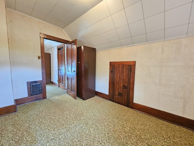 216 E Delaware St, Dwight, IL 60420 - carpeted empty room with a fireplace and lofted ceiling