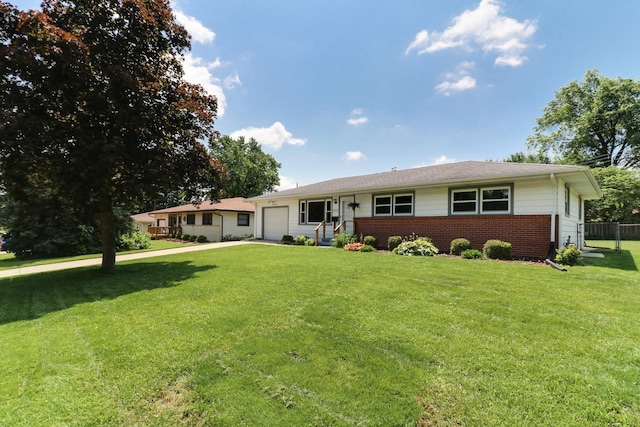 1001 Sheridan Rd, Normal, IL 61761 - ranch-style house with an attached garage and brick siding
