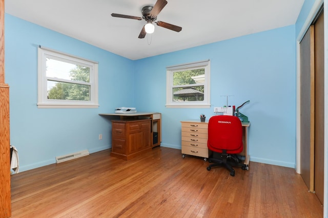 1001 Sheridan Rd, Normal, IL 61761 - home office featuring healthy amount of natural light, light wood-style floors, and a ceiling fan