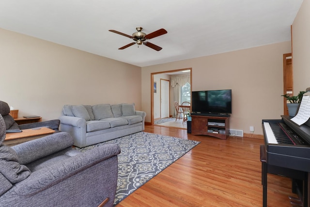 1001 Sheridan Rd, Normal, IL 61761 - living area with ceiling fan and light wood finished floors
