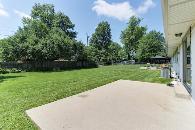 1001 Sheridan Rd, Normal, IL 61761 - fenced backyard featuring a patio area