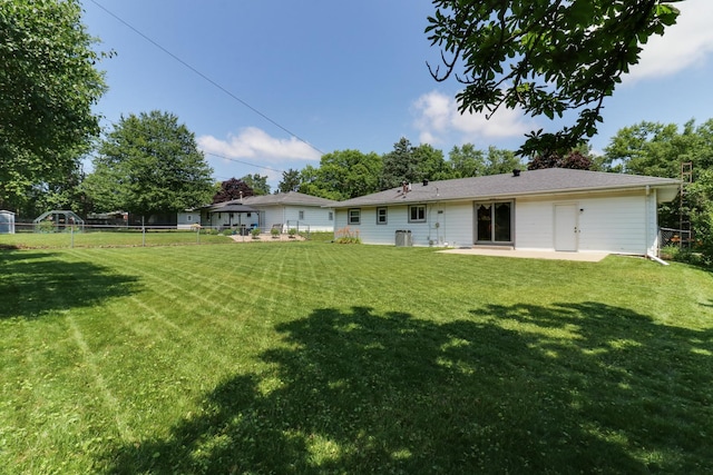 1001 Sheridan Rd, Normal, IL 61761 - rear view of property featuring a fenced backyard and a patio area