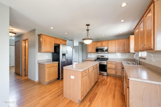 1884 Shore Line Ct, Romeoville, IL 60446 - kitchen featuring stainless steel appliances, tasteful backsplash, light wood finished floors, a center island, and light countertops