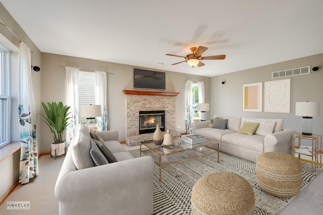 1884 Shore Line Ct, Romeoville, IL 60446 - carpeted living room with a ceiling fan and a fireplace