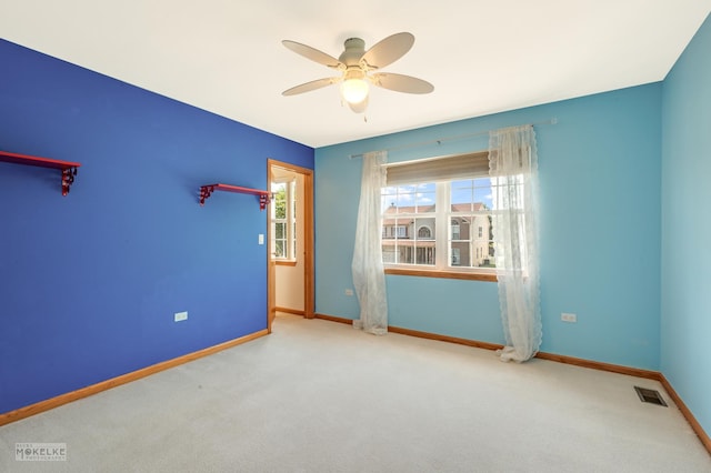 1884 Shore Line Ct, Romeoville, IL 60446 - spare room with a ceiling fan and carpet