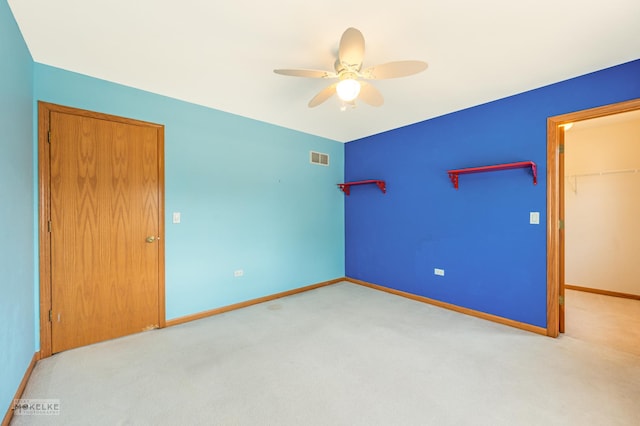 1884 Shore Line Ct, Romeoville, IL 60446 - unfurnished bedroom with a closet, carpet floors, a walk in closet, and a ceiling fan