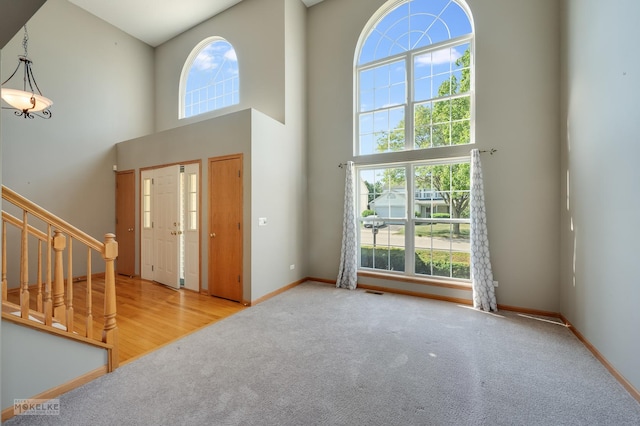 1884 Shore Line Ct, Romeoville, IL 60446 - entryway featuring a high ceiling, stairs, and carpet floors