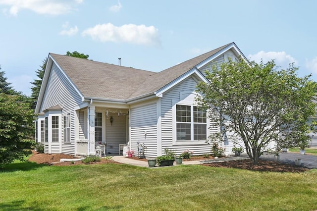 13120 Birmingham Ct, Beach Park, IL 60083 - view of front facade featuring a front lawn and roof with shingles