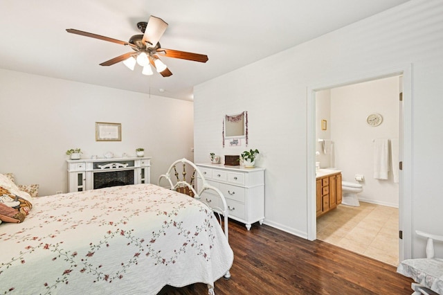 13120 Birmingham Ct, Beach Park, IL 60083 - bedroom featuring dark wood-style floors, ensuite bath, and a ceiling fan