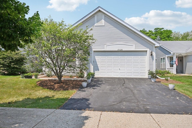 13120 Birmingham Ct, Beach Park, IL 60083 - view of front of home with driveway, an attached garage, and a front lawn