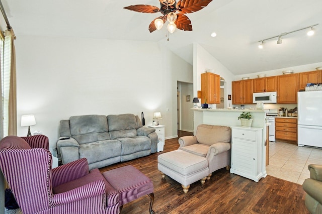 13120 Birmingham Ct, Beach Park, IL 60083 - living room with vaulted ceiling, a ceiling fan, and wood finished floors