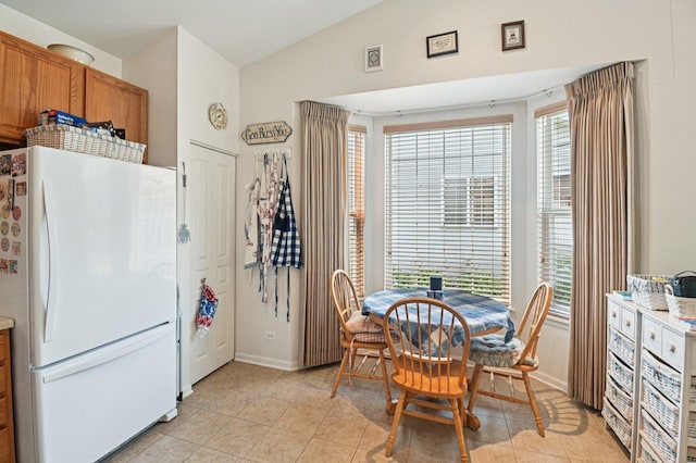 13120 Birmingham Ct, Beach Park, IL 60083 - dining area with vaulted ceiling, light tile patterned floors, and plenty of natural light