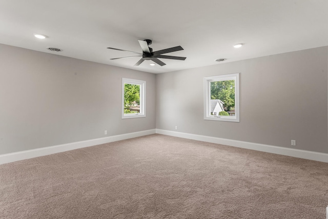1205 Broadmoor Dr, Champaign, IL 61821 - spare room featuring a ceiling fan, light colored carpet, and recessed lighting