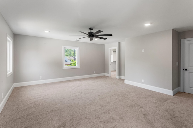 1205 Broadmoor Dr, Champaign, IL 61821 - empty room with ceiling fan, light colored carpet, and recessed lighting