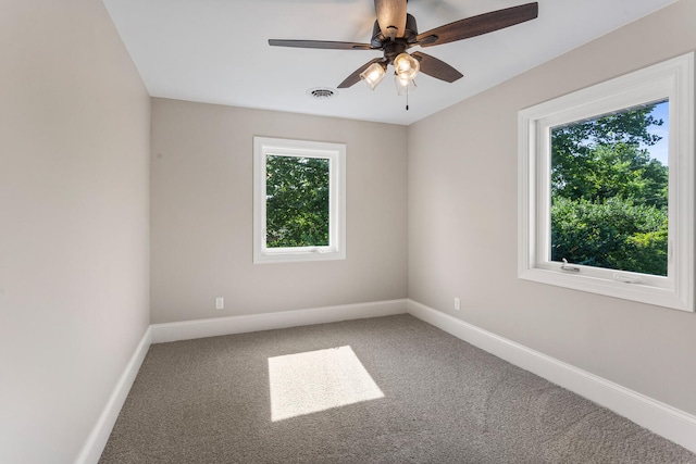 1205 Broadmoor Dr, Champaign, IL 61821 - carpeted empty room featuring baseboards and ceiling fan