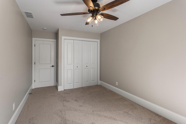 1205 Broadmoor Dr, Champaign, IL 61821 - unfurnished bedroom with carpet, a closet, and ceiling fan