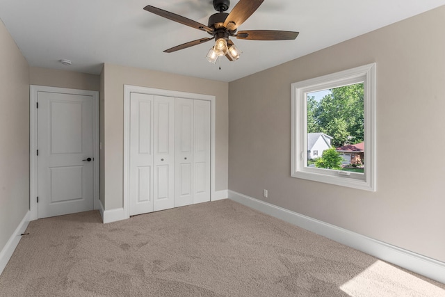 1205 Broadmoor Dr, Champaign, IL 61821 - unfurnished bedroom featuring carpet floors, a closet, and ceiling fan