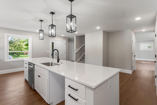 1205 Broadmoor Dr, Champaign, IL 61821 - kitchen with an island with sink, white cabinets, dark wood-style floors, recessed lighting, and pendant lighting