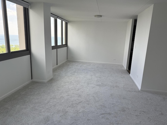 4850 S Lake Park Ave Unit 1508, Chicago, IL 60615 - carpeted spare room featuring baseboards