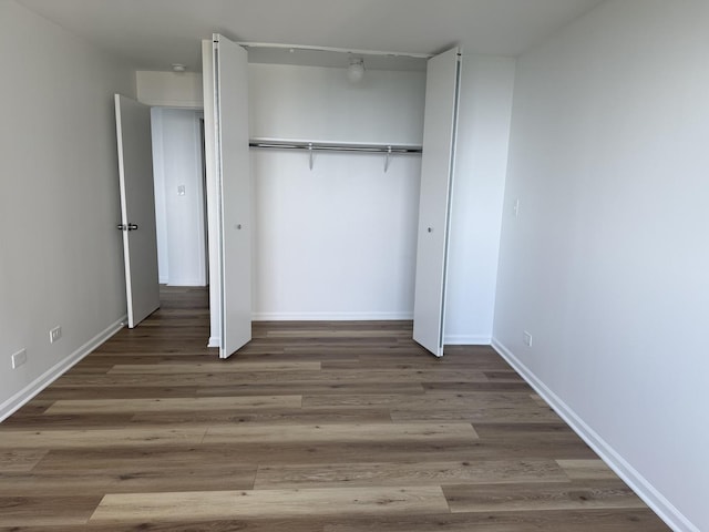 4850 S Lake Park Ave Unit 1508, Chicago, IL 60615 - unfurnished bedroom with a closet and wood finished floors
