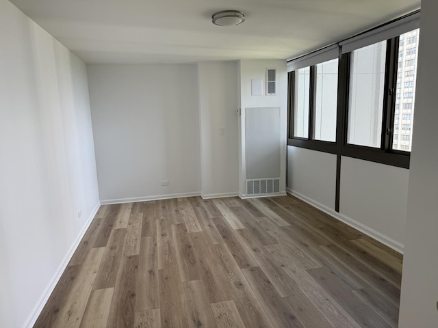4850 S Lake Park Ave Unit 1508, Chicago, IL 60615 - spare room featuring wood finished floors and baseboards