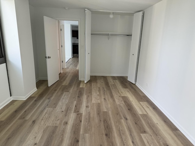 4850 S Lake Park Ave Unit 1508, Chicago, IL 60615 - unfurnished bedroom featuring light wood-style floors and a closet
