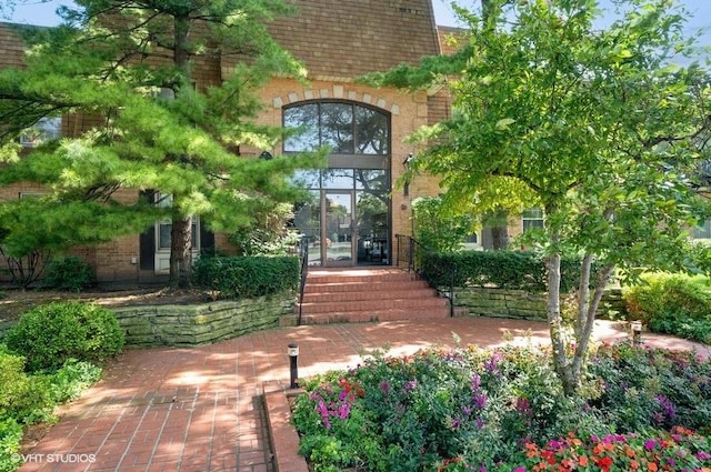 1220 Park Ave W Unit 110, Highland Park, IL 60035 - view of exterior entry featuring brick siding