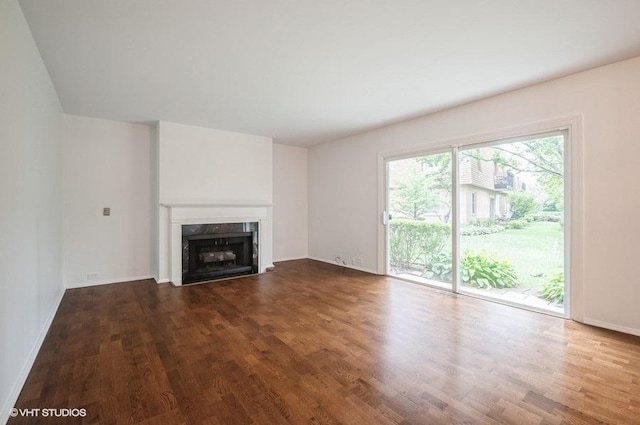 1220 Park Ave W Unit 110, Highland Park, IL 60035 - unfurnished living room featuring wood finished floors and a fireplace