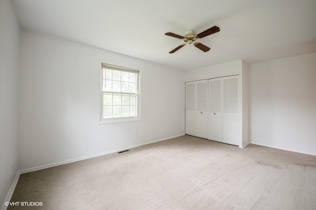 1220 Park Ave W Unit 110, Highland Park, IL 60035 - unfurnished bedroom featuring a closet, light colored carpet, and a ceiling fan