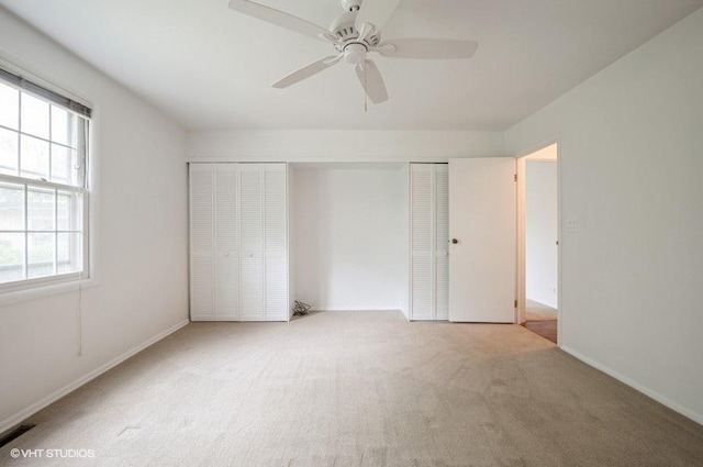 1220 Park Ave W Unit 110, Highland Park, IL 60035 - unfurnished bedroom with carpet, multiple windows, a closet, and ceiling fan