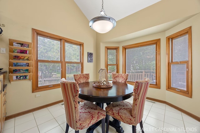 2436 Haider Ave, Naperville, IL 60564 - dining room featuring healthy amount of natural light, light tile patterned floors, and high vaulted ceiling