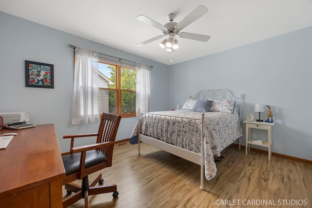 2436 Haider Ave, Naperville, IL 60564 - bedroom with light wood-style floors, a ceiling fan, and an office area