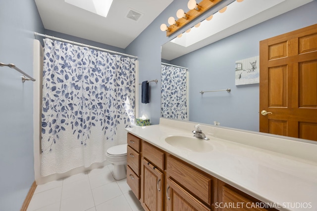 2436 Haider Ave, Naperville, IL 60564 - bathroom featuring vanity, tile patterned flooring, and a skylight