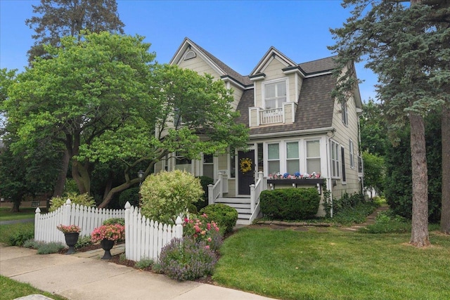 1109 N Dunton Ave, Arlington Heights, IL 60004 - view of front of house featuring a balcony and roof with shingles