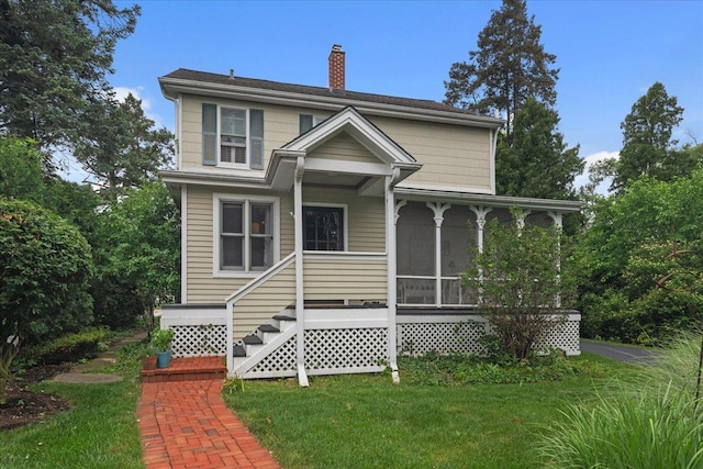 1109 N Dunton Ave, Arlington Heights, IL 60004 - view of front of property with a chimney and a front lawn