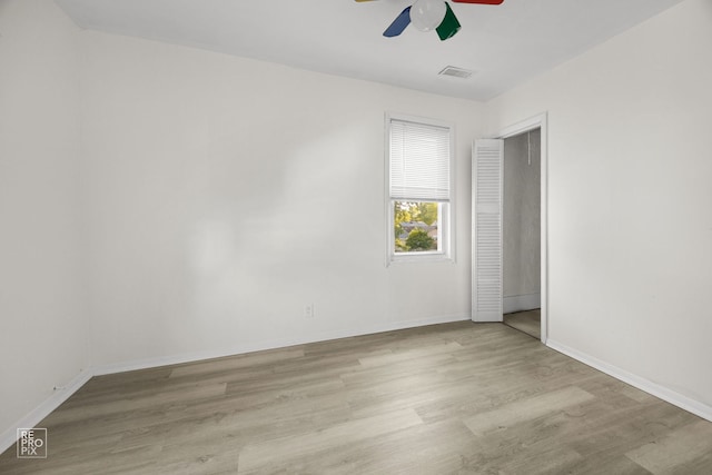 834 Spruce St, Aurora, IL 60506 - unfurnished bedroom with wood finished floors and a ceiling fan