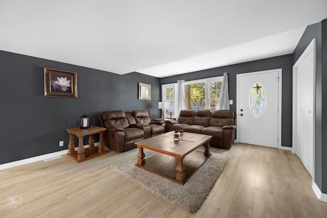 834 Spruce St, Aurora, IL 60506 - living room with light wood-style flooring and baseboards