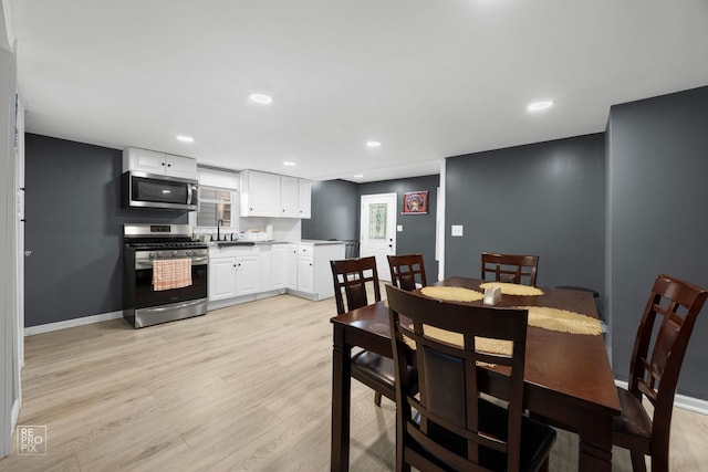 834 Spruce St, Aurora, IL 60506 - dining area with light wood finished floors and recessed lighting