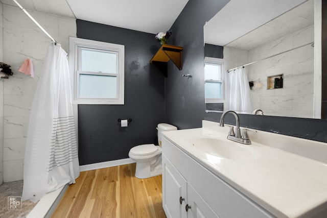 834 Spruce St, Aurora, IL 60506 - full bathroom featuring vanity, a shower with shower curtain, and wood finished floors