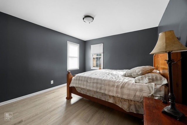 834 Spruce St, Aurora, IL 60506 - bedroom featuring light wood-style floors and baseboards