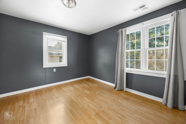 834 Spruce St, Aurora, IL 60506 - unfurnished room with light wood-style floors and baseboards