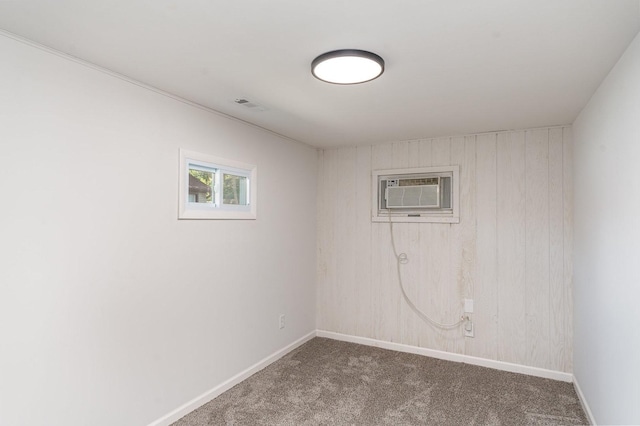 16649 W 147th Pl, Lockport, IL 60441 - empty room featuring a wall unit AC, carpet, and wooden walls