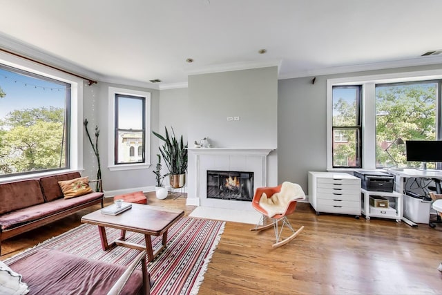 3253 W Palmer St Unit 301, Chicago, IL 60647 - living room featuring a tile fireplace, crown molding, wood finished floors, and an office area