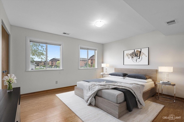 2301 Bicentennial Ave Unit 5, Crest Hill, IL 60403 - bedroom with light wood-type flooring and baseboards
