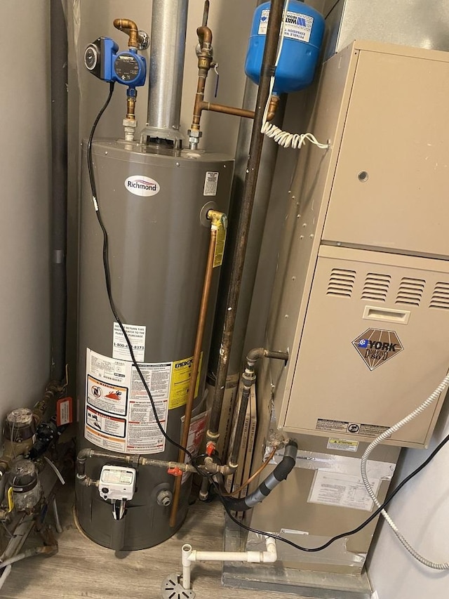 13065 Big Horn Dr, Huntley, IL 60142 - utility room featuring gas water heater and heating unit