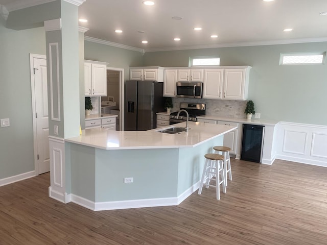 13065 Big Horn Dr, Huntley, IL 60142 - kitchen featuring stainless steel appliances, tasteful backsplash, light wood-style floors, crown molding, and recessed lighting