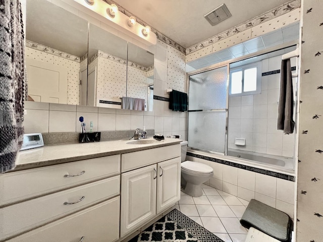 6631 W 89th Pl, Oak Lawn, IL 60453 - full bath with vanity, tiled shower / bath, tile patterned floors, tile walls, and decorative backsplash