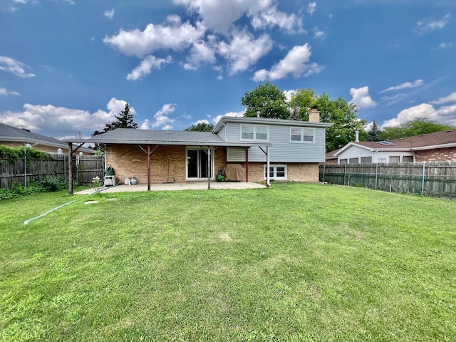 6631 W 89th Pl, Oak Lawn, IL 60453 - rear view of house featuring a patio, brick siding, and a fenced backyard