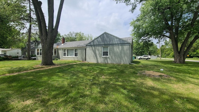 16002 Spaulding Ave, Markham, IL 60428 - rear view of property featuring a chimney and a yard